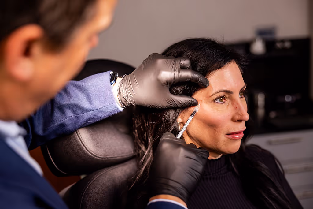 A patient receiving a customized injectable treatment